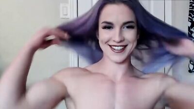 Amateur female bodybuilder is showing her muscles and firm booty